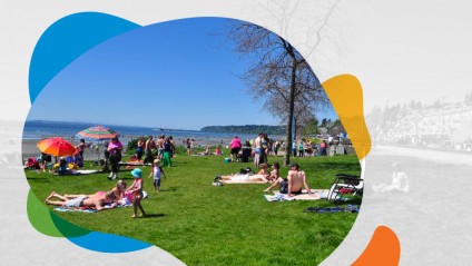People relaxing on the lawn at East Beach, White Rock, South Surrey, British Columbia, Canada