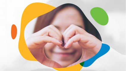 A female forming a heart with her two hands