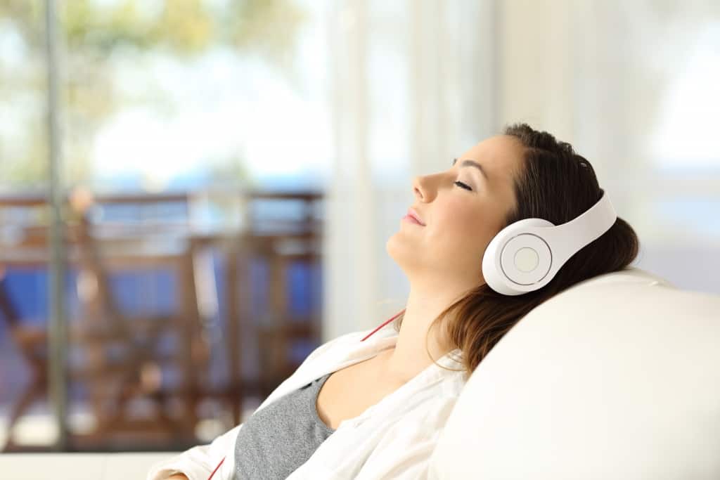 woman relaxing to music finding a good rental
