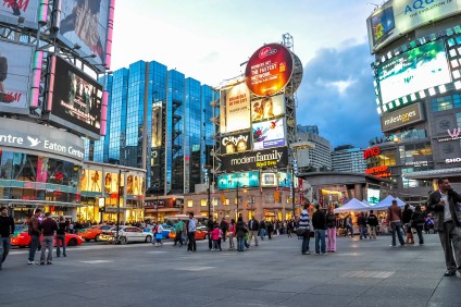 Toronto's Dundas Square. Buying Canadian commercial real estate