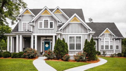 Front view of a large home with vibrant landscaping