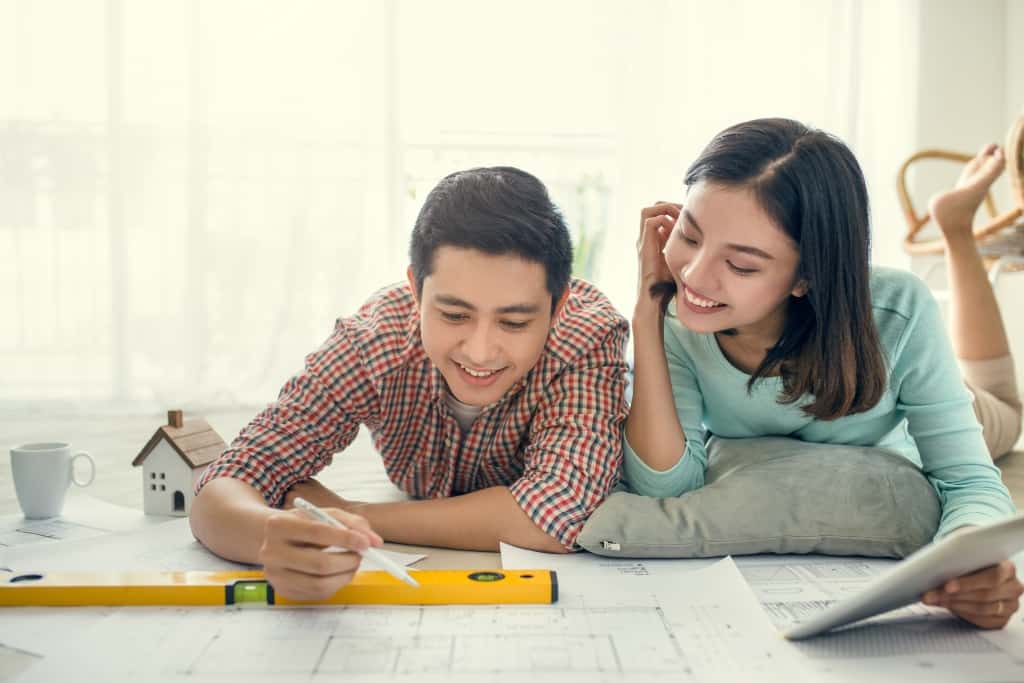 couple looking at blueprint