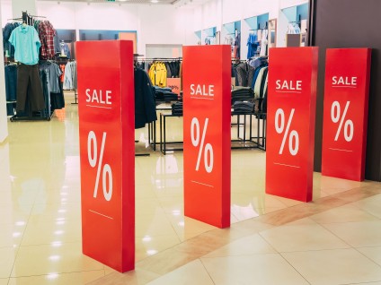 average housing price   buyers shop sale signs at store