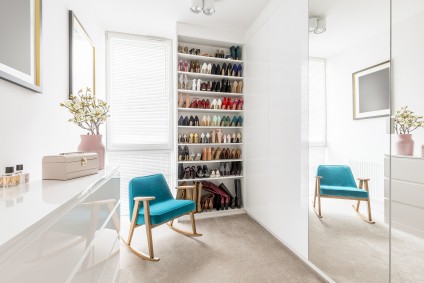 Totally organized clutter free bright white closet dressing room zolo