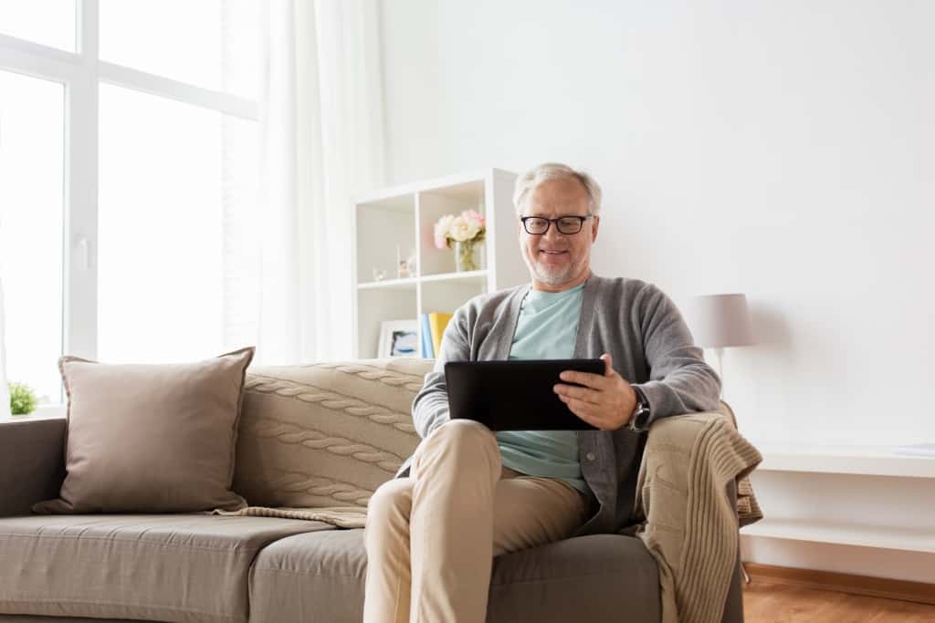technology, old age, people and lifestyle concept happy smilin