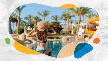 Woman sitting by pool on vacation