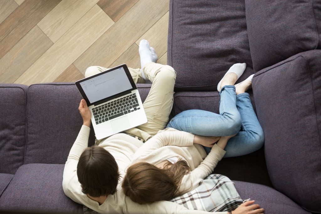 Young couple sorting out taxes on a laptop