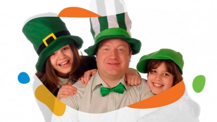 A family portrait of a dad and his two daughters celebrating St.