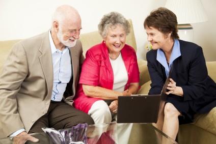 Older couple talks to Realtor about selling their home Zolo