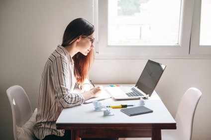 Millennial woman doing work at a desk
