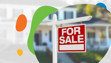 For sale sign in front of a house