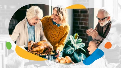 3 generations of a family at a dinner table looking at a turkey