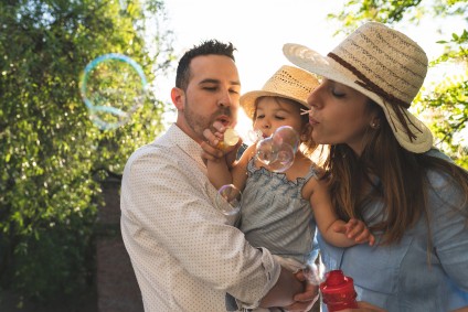 family holding daughter