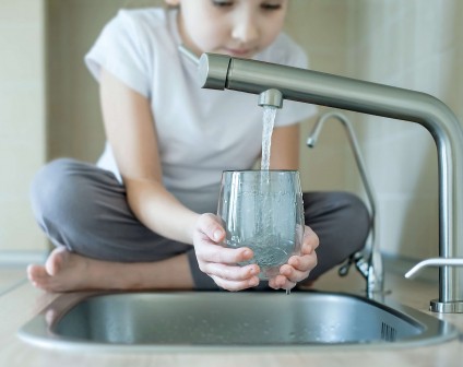 Child water at touchless faucet norovirus prevention
