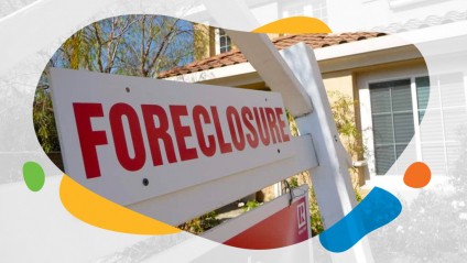A foreclosure sign sitting in front of a house
