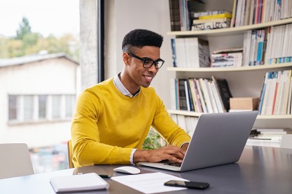 Young man freelance remote work on computer
