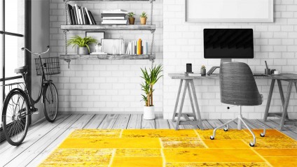 black and white Zolo custom image of a clutter free home office with yellow rug and a bike