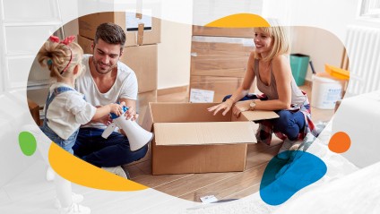 little girl helps parents unpack in new home
