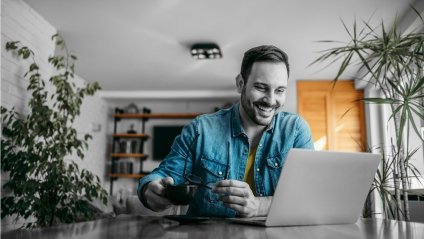 man at his desk looking at computer