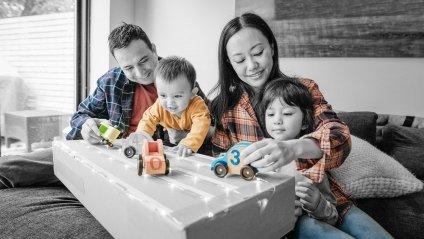 family playing with toy cars