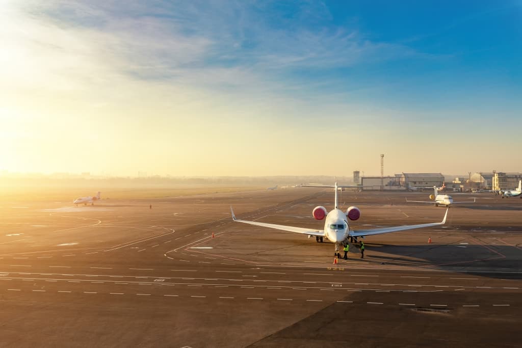 Colorful scenic dramatic morning sunset at airport asphalt taxiway