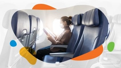 Woman flies on plane wearing mask