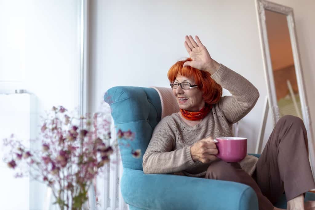 Waving to neighbors through the window