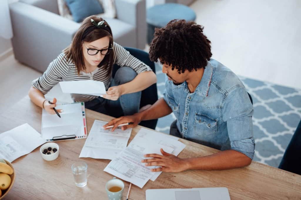 Young couple learning how to budget
