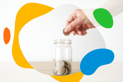 hand putting coin in a jar