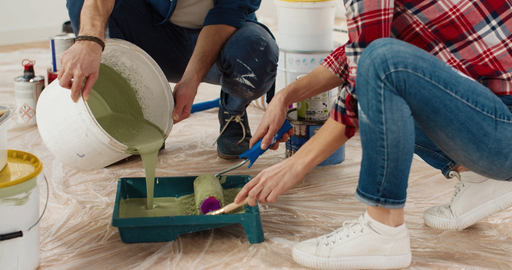 Wife helping her husband to repair home room working together