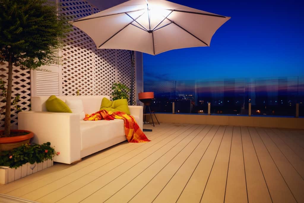 beautiful modern rooftop patio terrace with evening city view