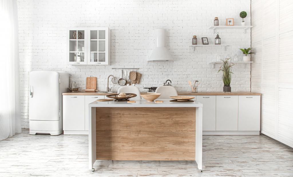 Modern stylish Scandinavian kitchen interior with kitchen accessories. Bright white kitchen with household items