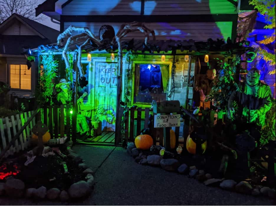 haunted house with green lights and halloween decorations