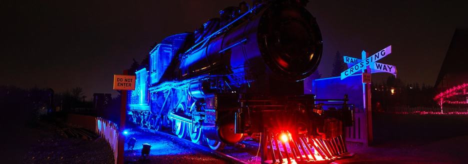 spooky train lit up by blue and red lights