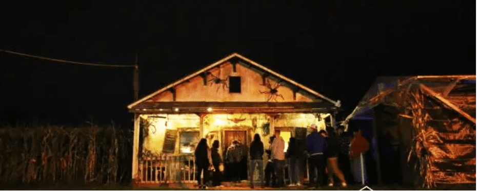 haunted house with people lined outside