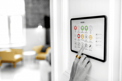 woman interacting with smart home tech