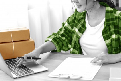 divorce marital emergency checklist - woman working at a laptop and making notes
