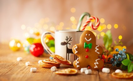 Christmas gingerbread cookies with Christmas decorations on wood