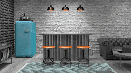 view of bar with barstools and a vintage refrigerator and sofa