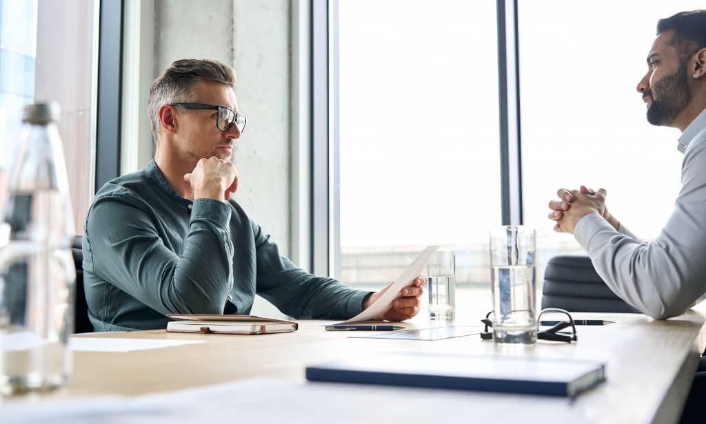 Two men having a discussion in a meeting room