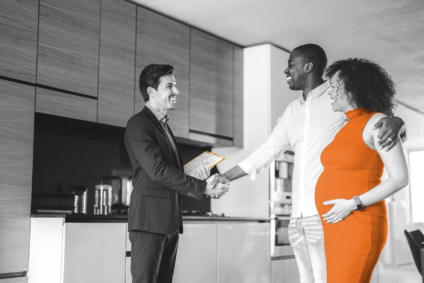 couple meet real estate agent