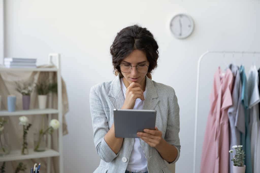 woman staring at ipad
