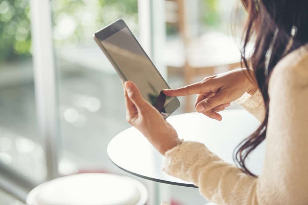 woman reading from a tablet
