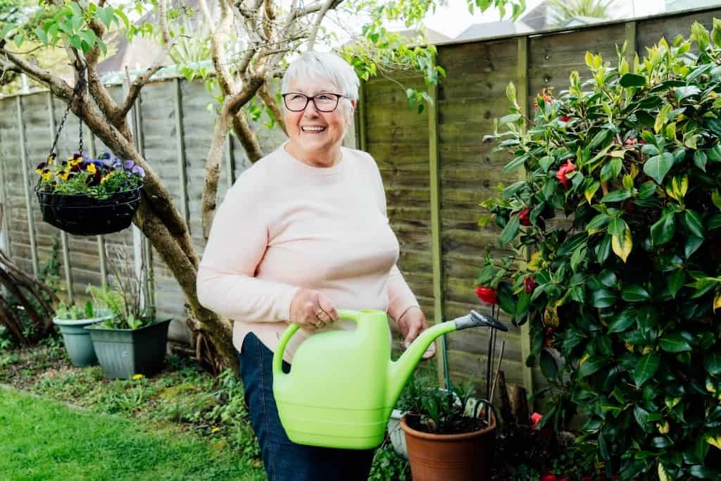 woman holding watering can