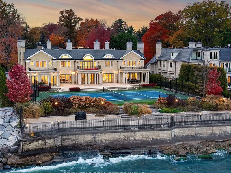 Large mansion with a tennis court on the shores of Lake Ontario