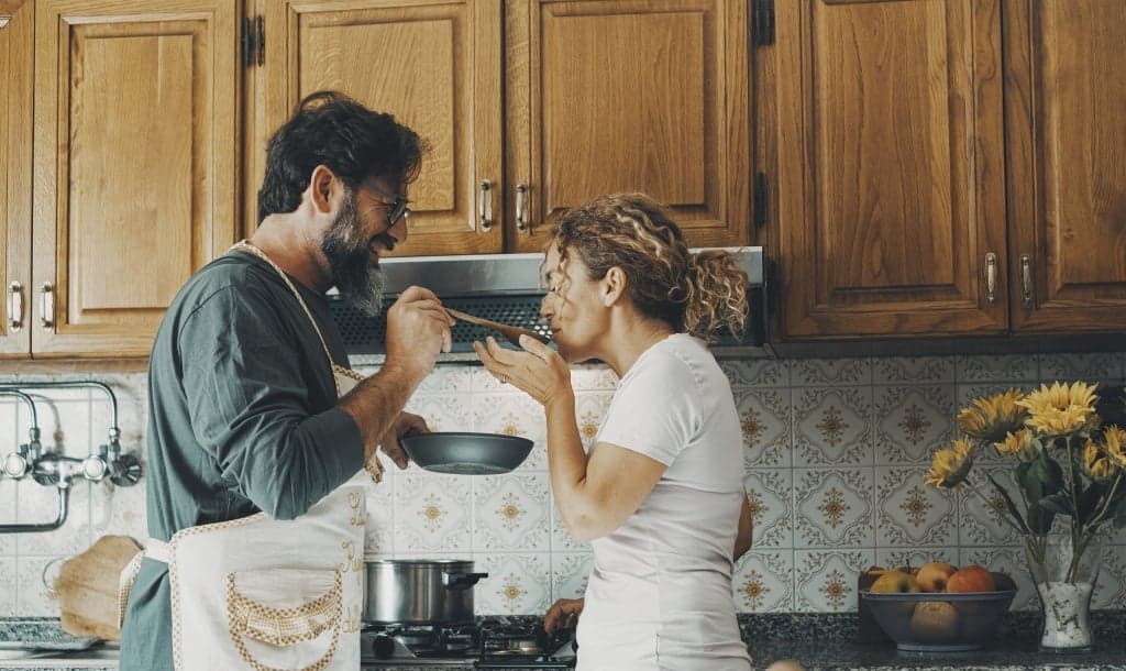 Couple eating in kitchen