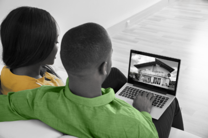 Couple comparing sold home prices in Canada