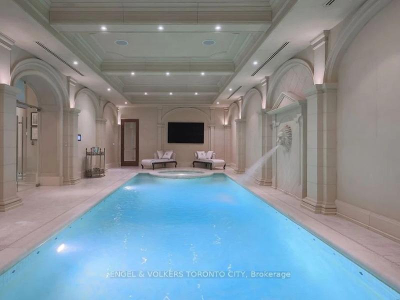 Indoor pool with white marble walls