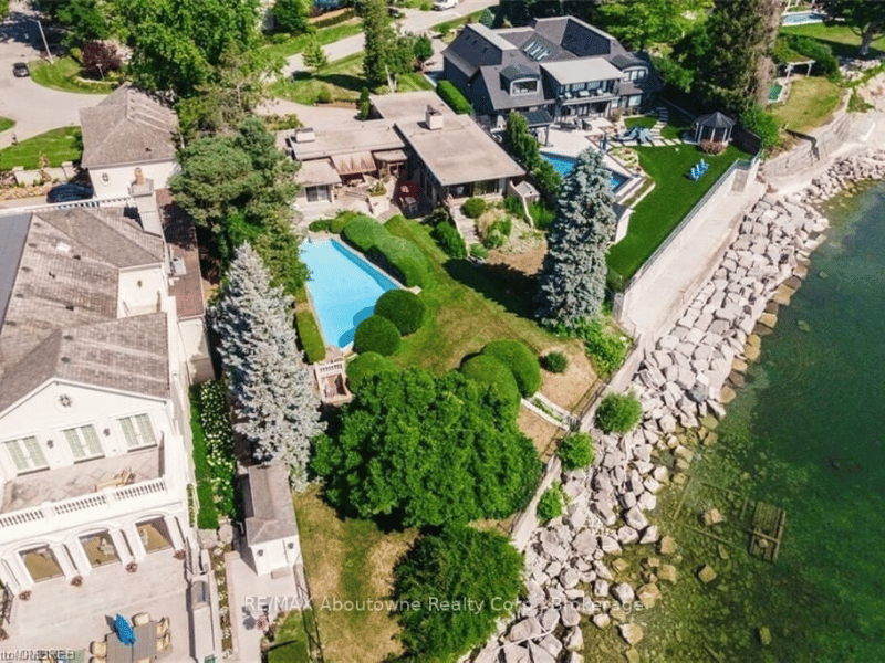 arial shot of home with a pool on the shores of Lake Ontario